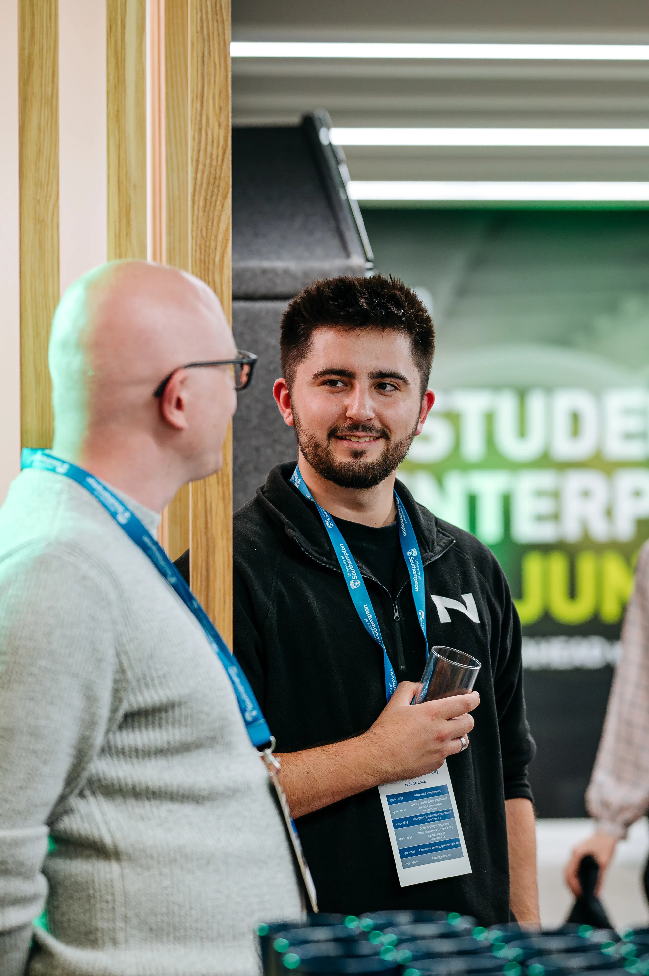 James in conversation at a conference