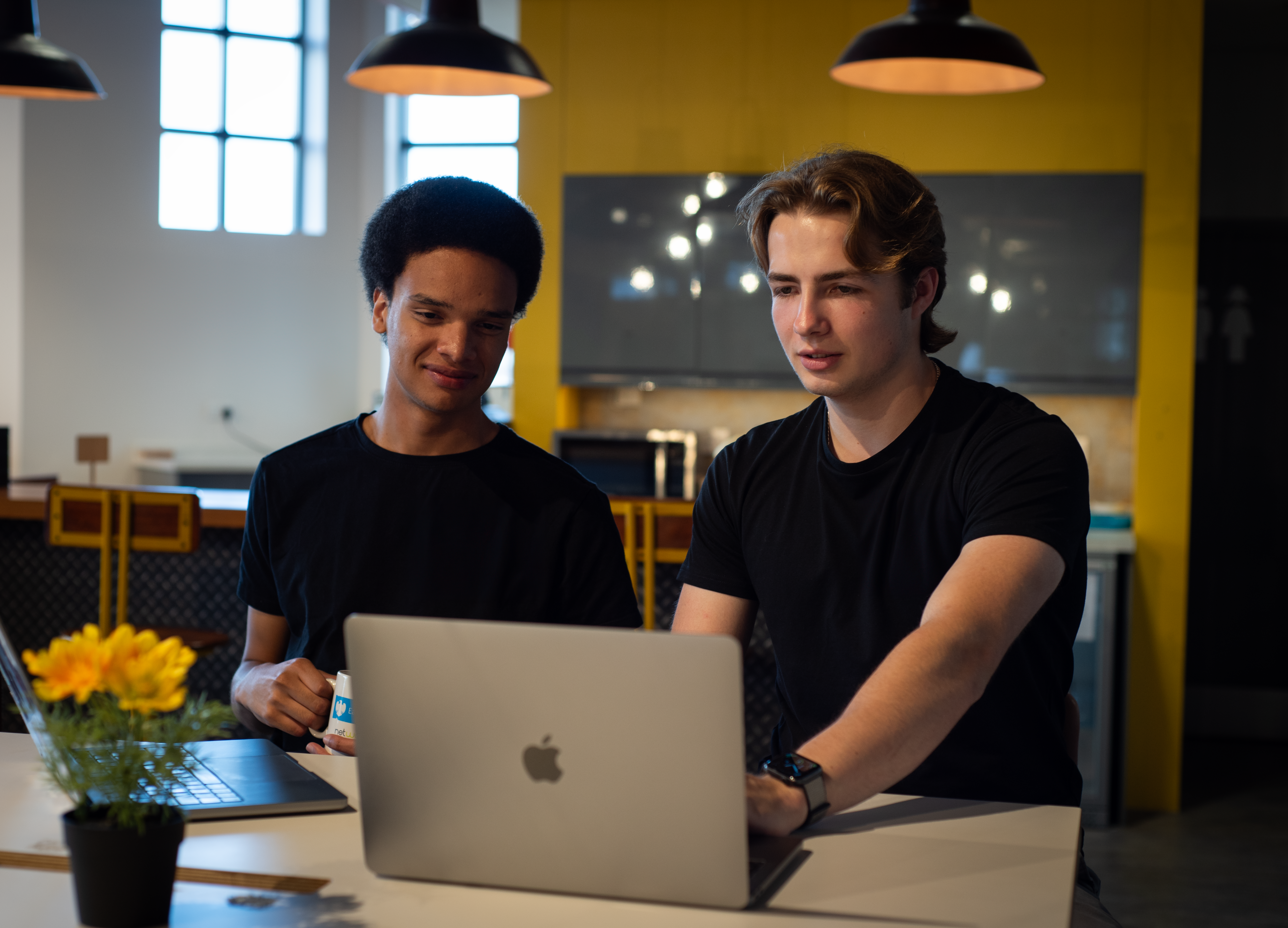 An artist working at a laptop